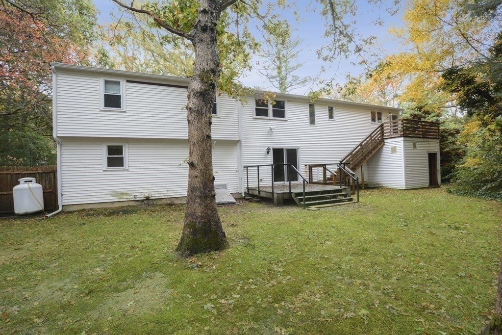 499 Skunknet Road Barnstable, MA 02632 - Photo 15 of 16 a view of a house with backyard and a tree