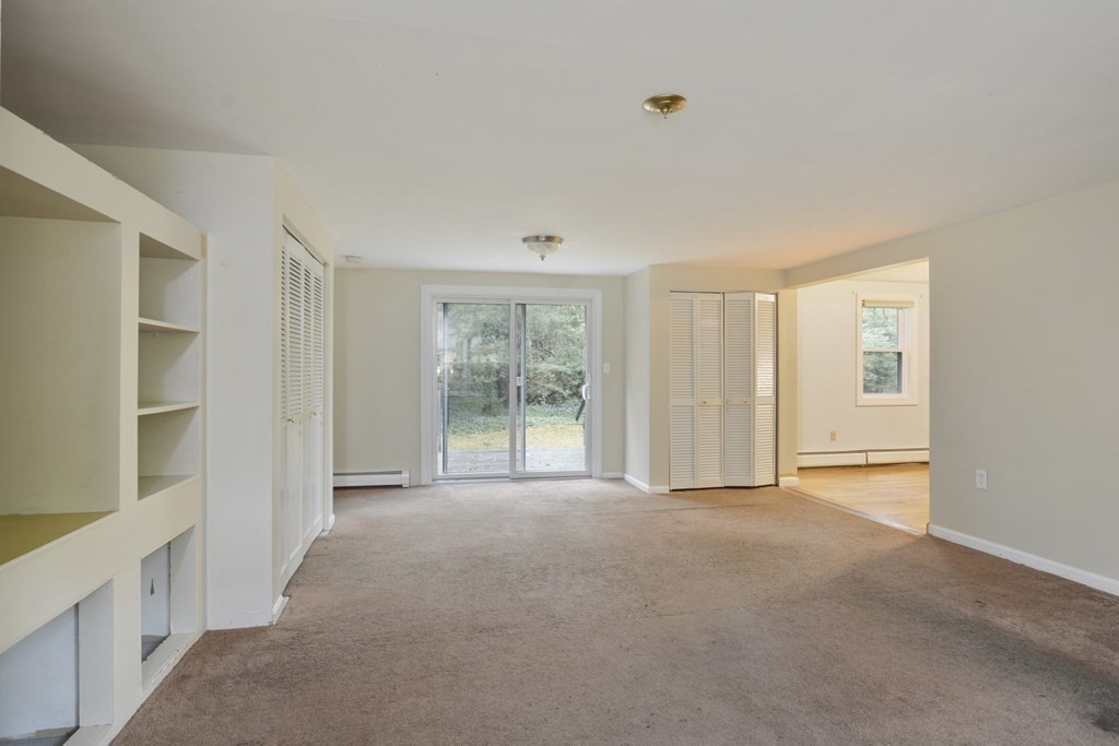 499 Skunknet Road Barnstable, MA 02632 - Photo 7 of 16 a view of an empty room with a window