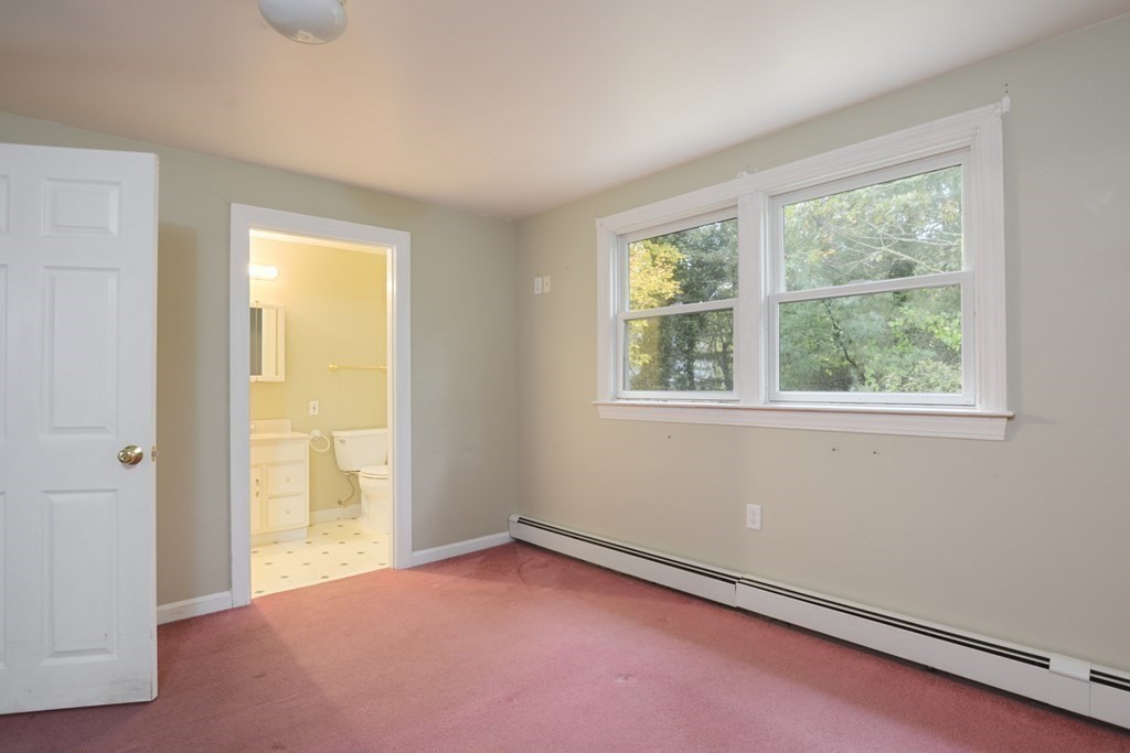 499 Skunknet Road Barnstable, MA 02632 - Photo 8 of 16 a view of an empty room with a window