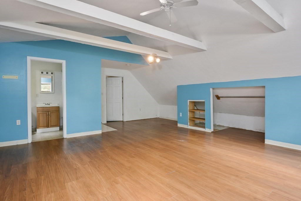 499 Skunknet Road Barnstable, MA 02632 - Photo 10 of 16 a view of an empty room with window and wooden floor