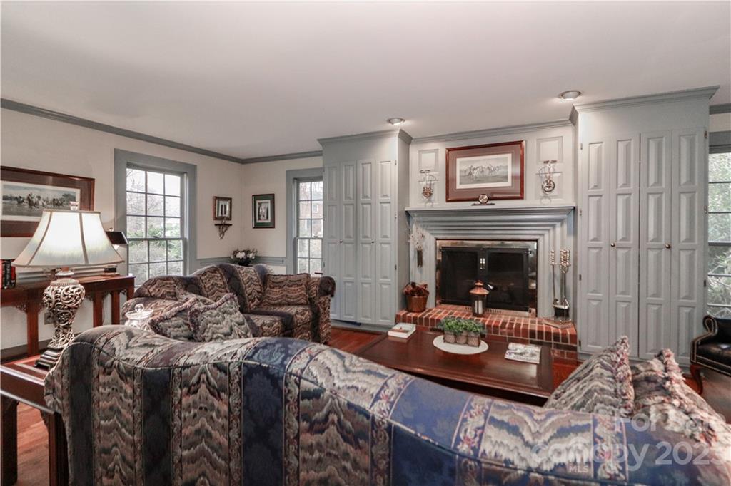 415 Westchester Road Statesville, NC 28625 - Photo 11 of 48 a living room with furniture a large window and a fireplace