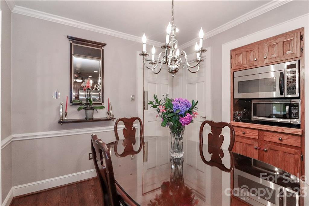 415 Westchester Road Statesville, NC 28625 - Photo 24 of 48 a view of a dining room with furniture and chandelier