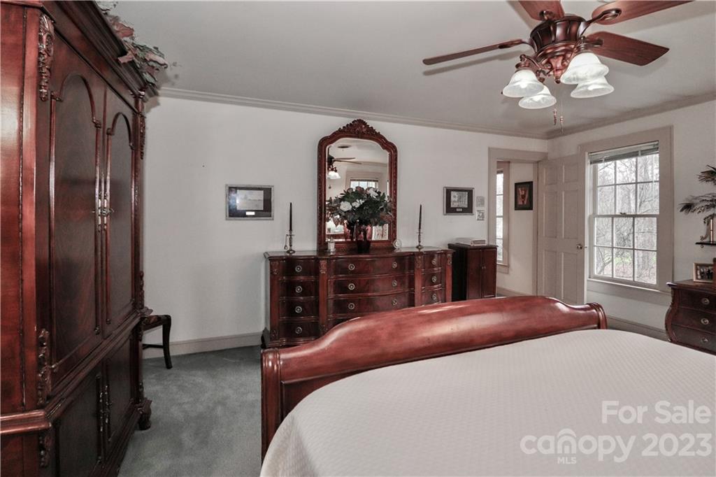 415 Westchester Road Statesville, NC 28625 - Photo 32 of 48 a bed room with a bed and a mirror