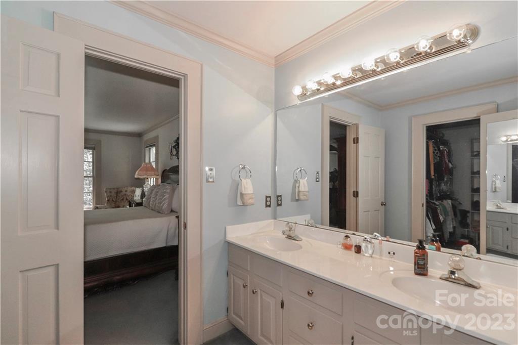 415 Westchester Road Statesville, NC 28625 - Photo 34 of 48 a en suite bathroom with a double vanity sink and a mirror