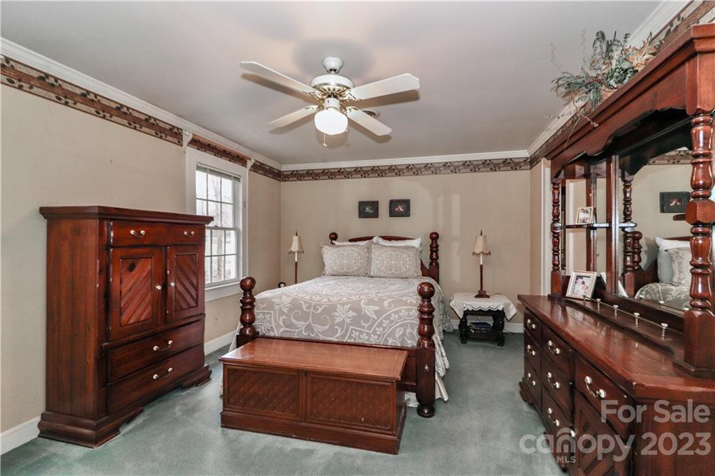 415 Westchester Road Statesville, NC 28625 - Photo 36 of 48 a bedroom with furniture and wooden floor