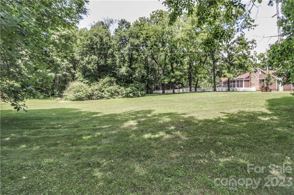 415 Westchester Road Statesville, NC 28625 - Photo 38 of 48 a view of a field with trees in the background