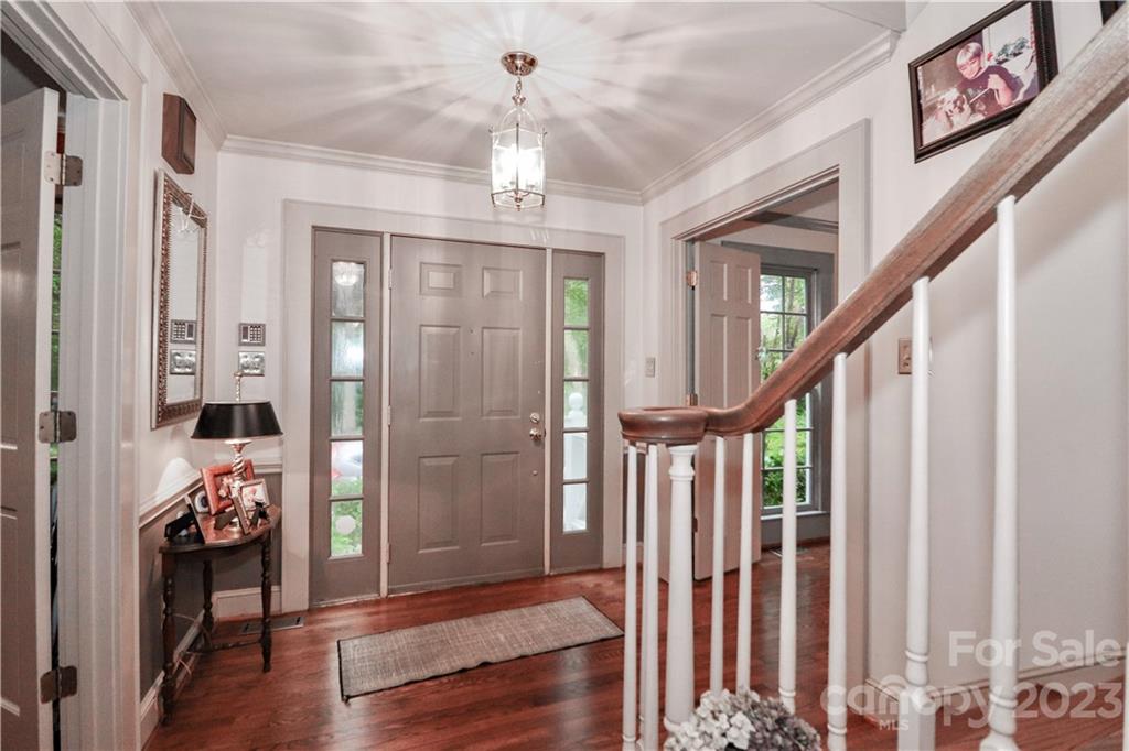 415 Westchester Road Statesville, NC 28625 - Photo 6 of 48 a view of an entryway with wooden floor and stairs