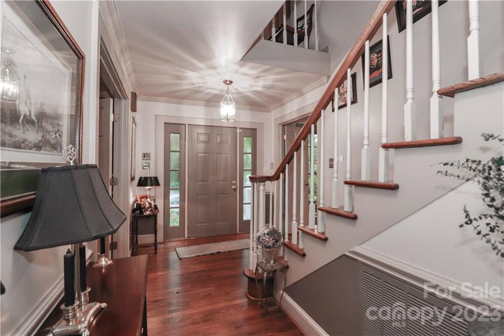 415 Westchester Road Statesville, NC 28625 - Photo 7 of 48 a view of entryway with wooden floor and stairs