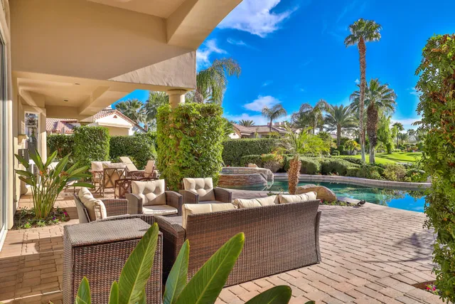 a view of a terrace with couches and potted plants
