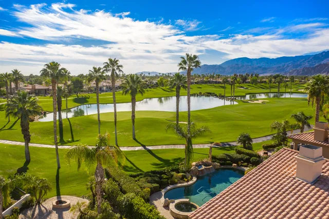 a bedroom with a bed and flat screen tv