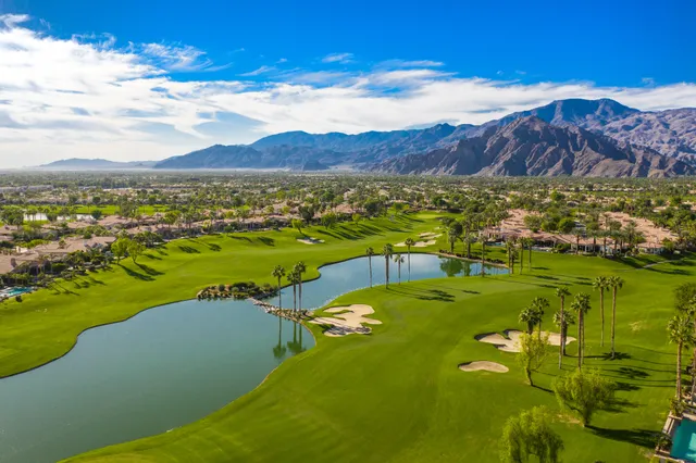 a bathroom with a shower sink and mirror