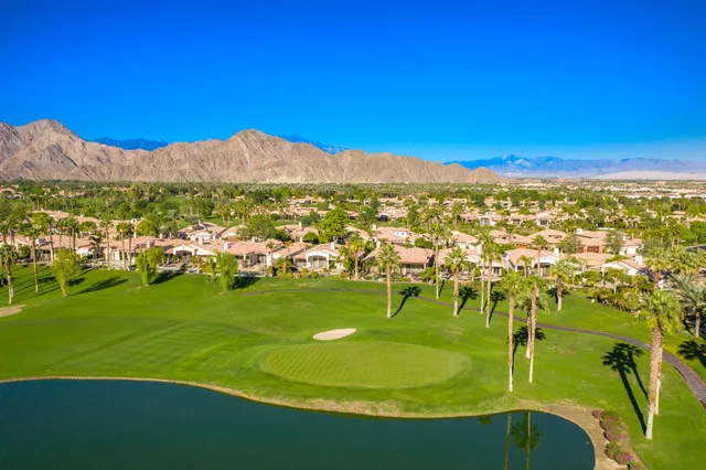 a kitchen with a sink counter top space appliances and cabinets