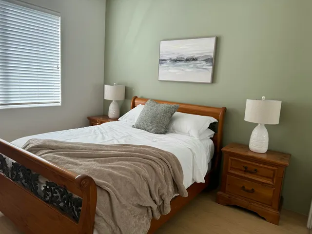 a living room with furniture a dining table and a chandelier