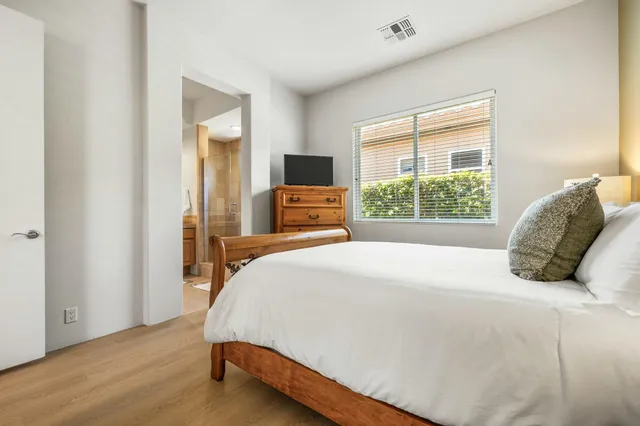 a spacious bathroom with a granite countertop tub and a sink