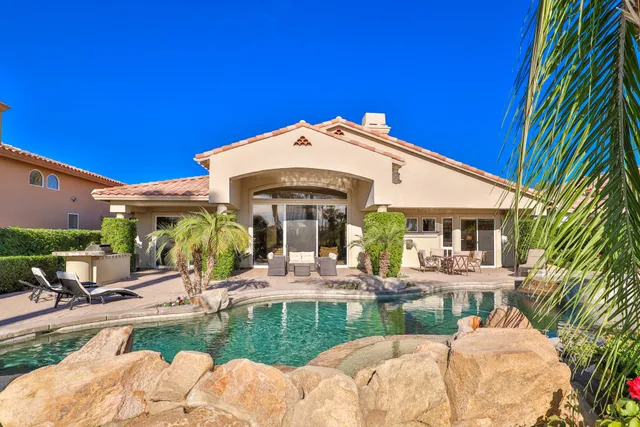 a view of a swimming pool with a patio