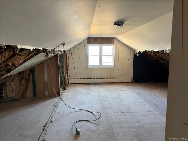 a white toilet sitting in a bathroom next to a sink