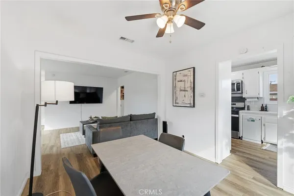 a kitchen with kitchen island and stainless steel appliances