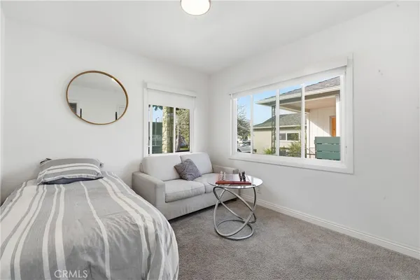 a bedroom with bed and a window