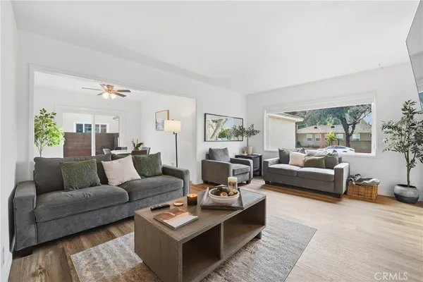 a living room with furniture and a large window