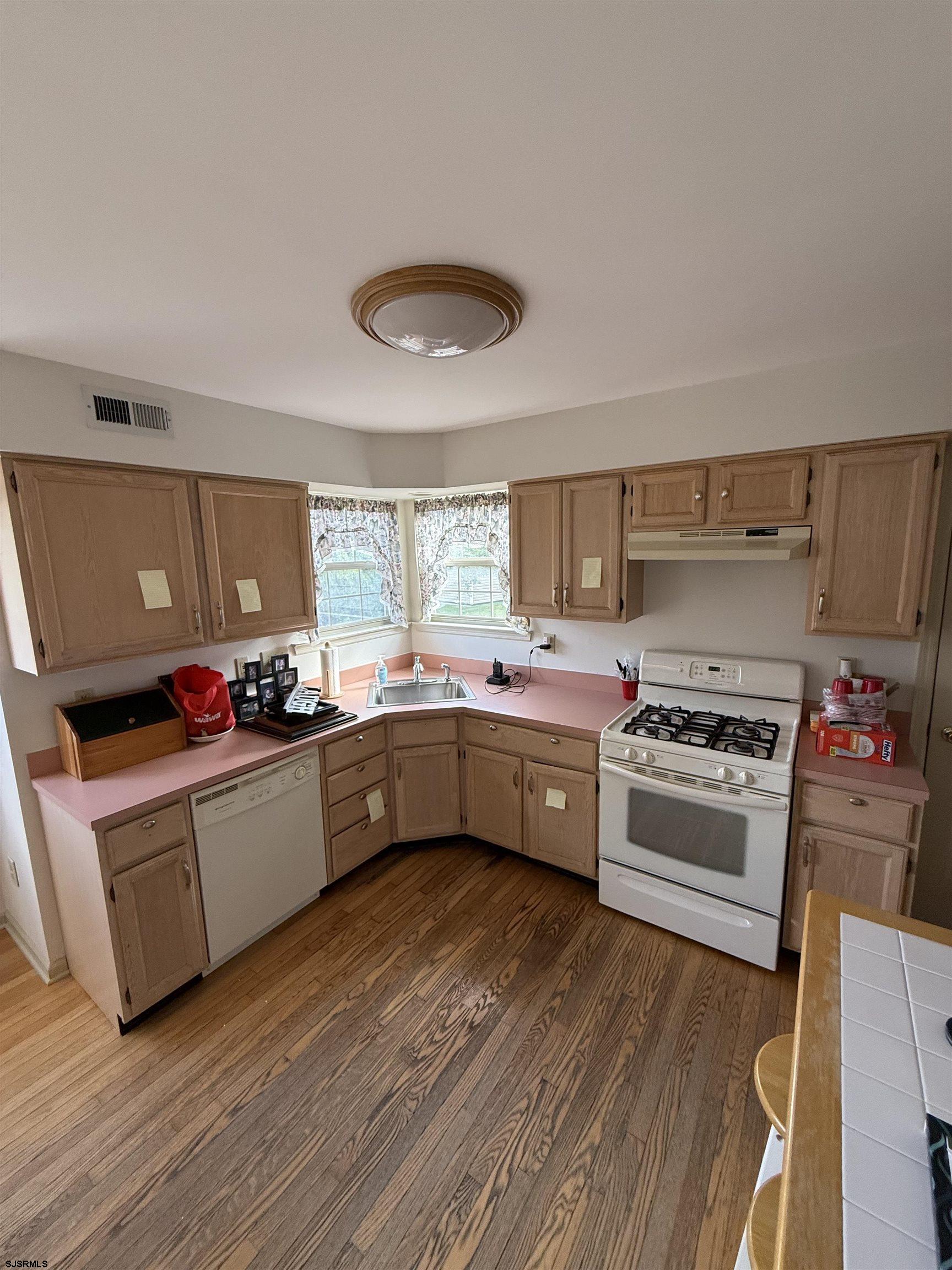 3 Teaberry Lane Riverside, NJ 08075 - Photo 5 of 11 a kitchen with granite countertop a sink cabinets and stainless steel appliances