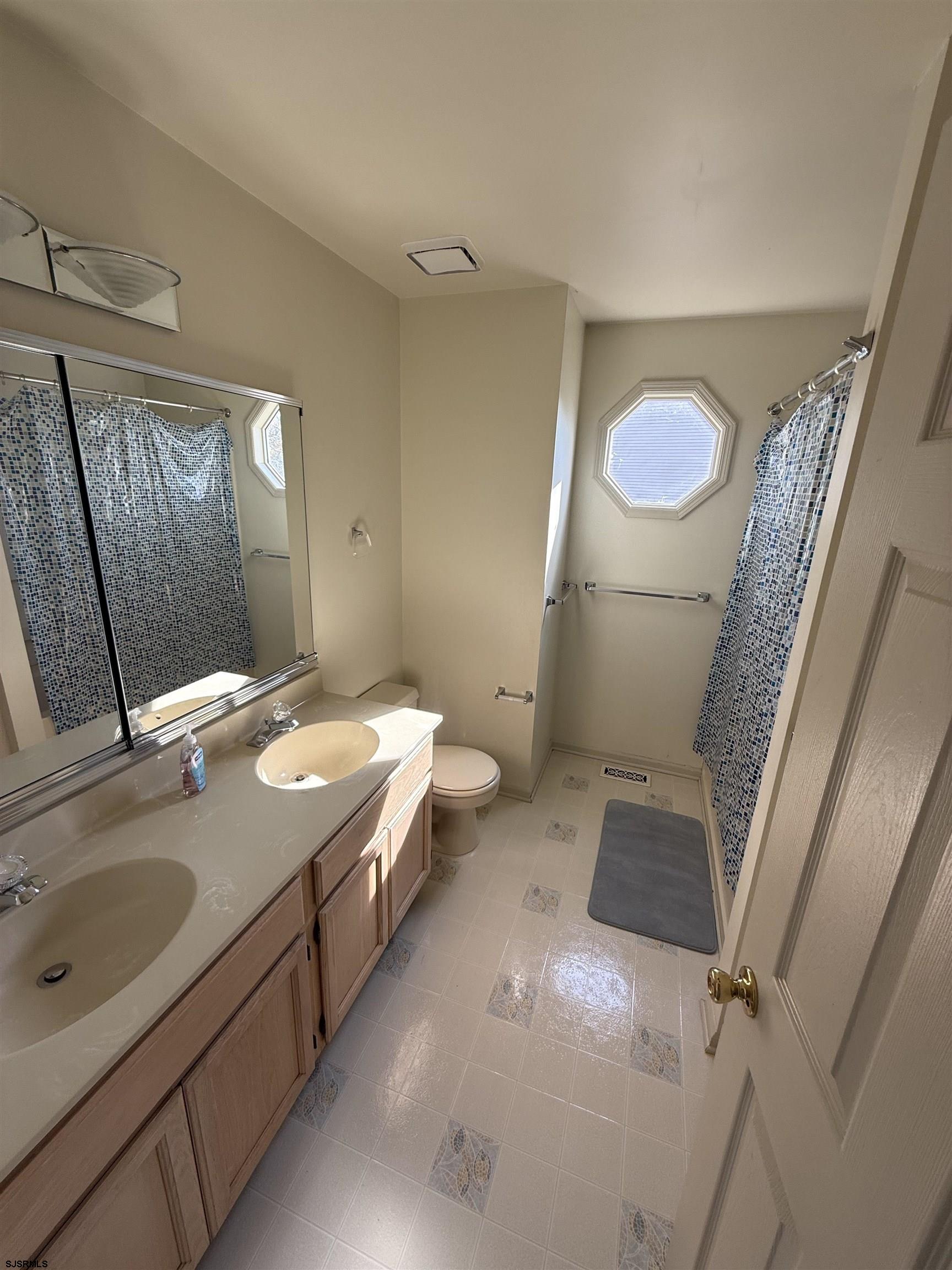 3 Teaberry Lane Riverside, NJ 08075 - Photo 7 of 11 a bathroom with a granite countertop sink toilet and shower