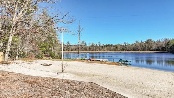 a view of a park with snow on the road