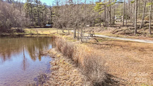 a view of a lake in between two chairs