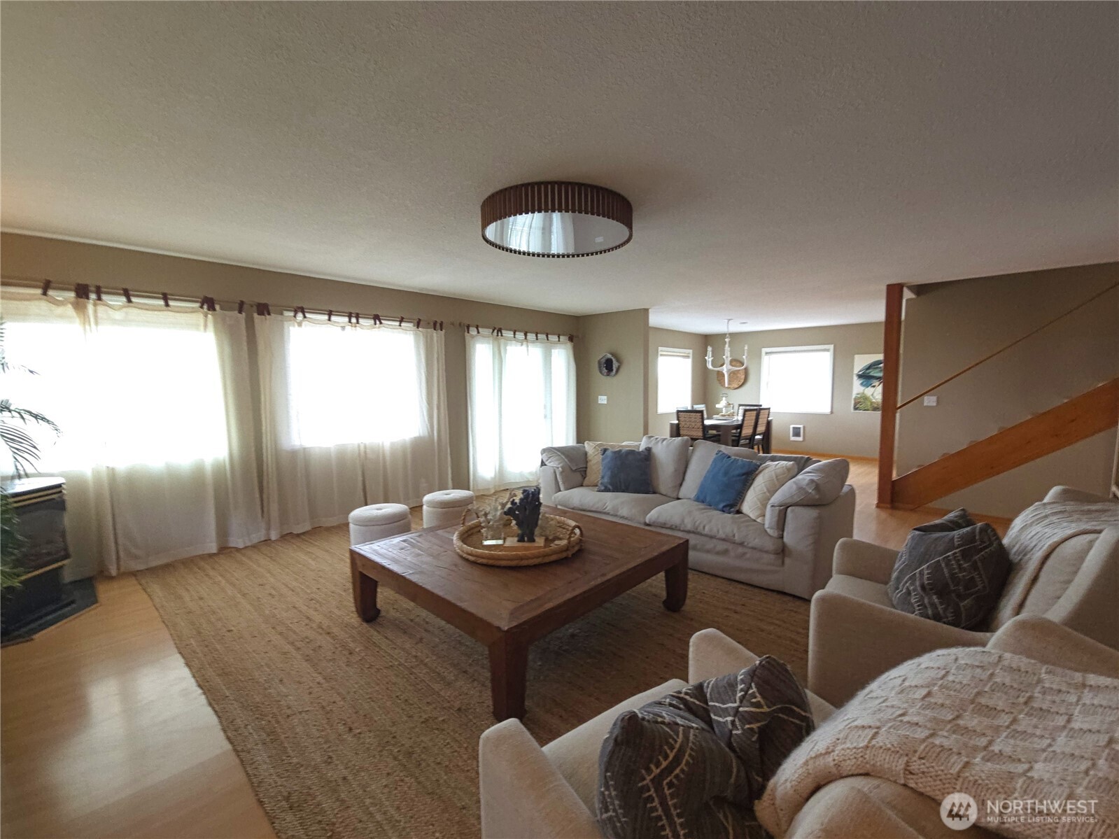 240 Stringtown Road Ilwaco, WA 98624 - Photo 6 of 39 a living room with furniture and a large window