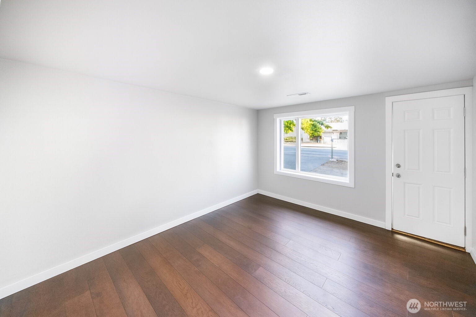 4908 236th Street Southwest Mountlake Terrace, WA 98043 - Photo 17 of 21 an empty room with wooden floor and window