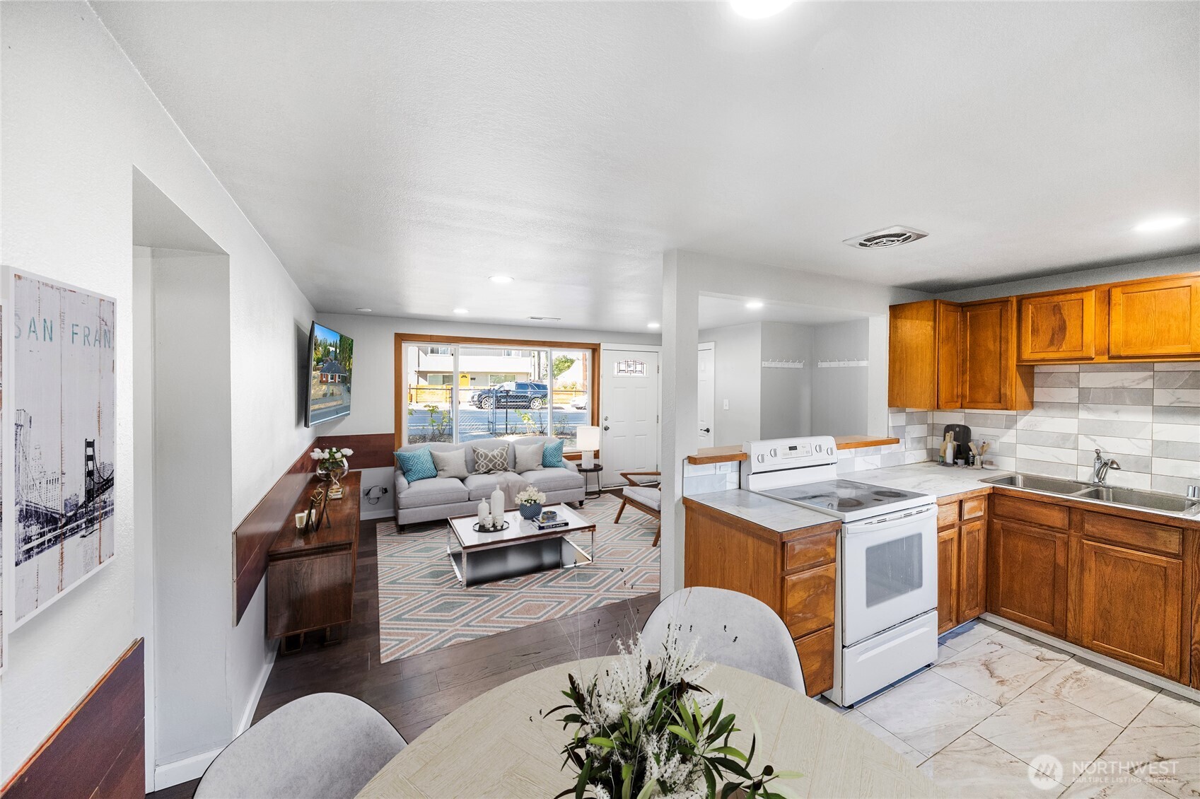 4908 236th Street Southwest Mountlake Terrace, WA 98043 - Photo 6 of 21 a living room with a couch and a view of kitchen