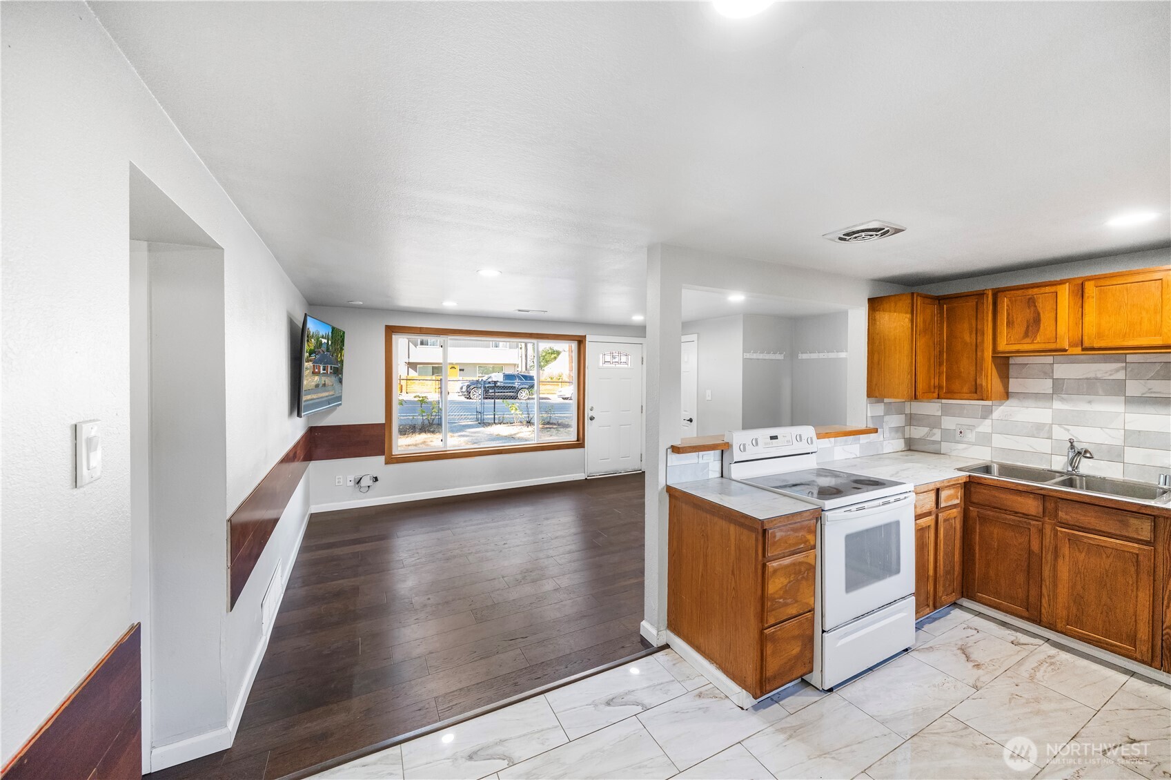 4908 236th Street Southwest Mountlake Terrace, WA 98043 - Photo 7 of 21 a kitchen with a stove and a sink