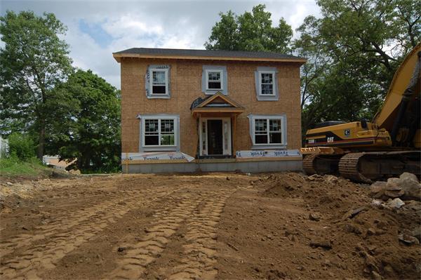 21 Hillcrest Road Waltham, MA 02451 - Photo 2 of 8 a front view of a house with a yard