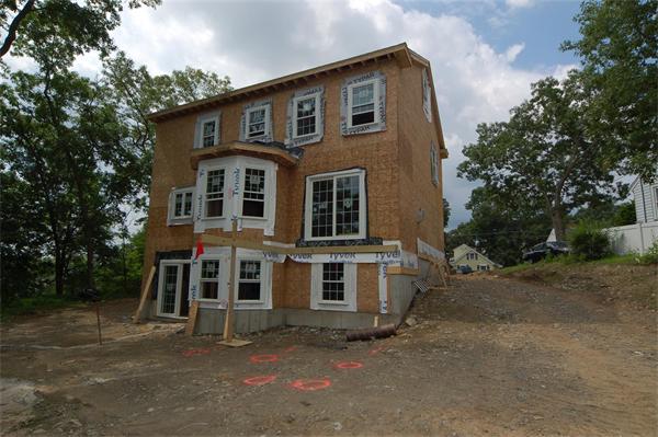 21 Hillcrest Road Waltham, MA 02451 - Photo 3 of 8 a front view of a house with a yard