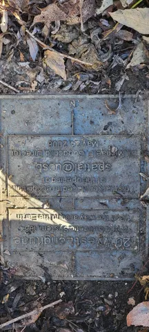 a view of a street with a bench