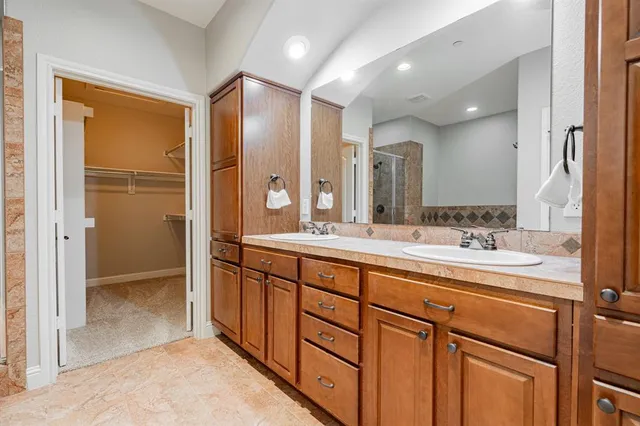 a bathroom with a bathtub and a shower