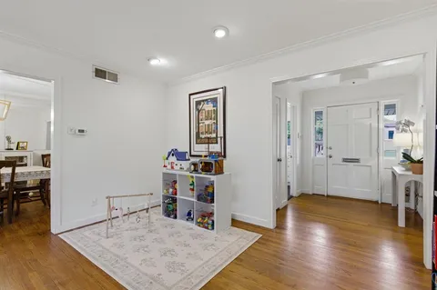 a view of a livingroom with furniture and wooden floor