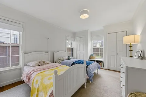 a bed room with a bed and a lamp