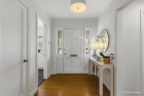 a bedroom with bed and a mirror