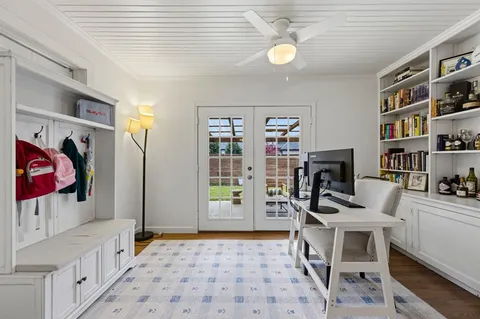 a bedroom with furniture and a book shelf