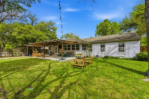 a view of a house with pool table and chairs