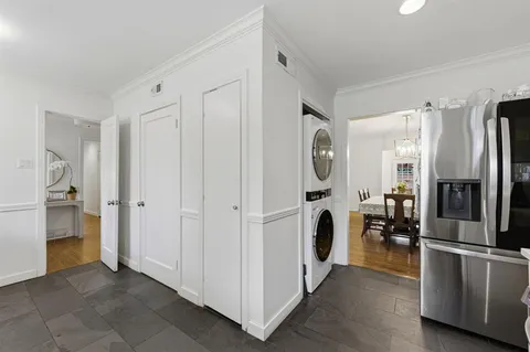 a view of a kitchen with refrigerator and car