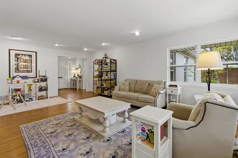a living room with furniture and a table