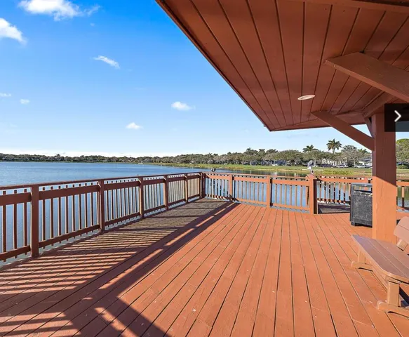a view of balcony with wooden floor