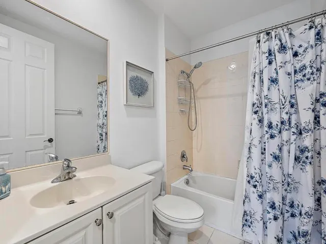 a bathroom with a sink toilet tub and shower