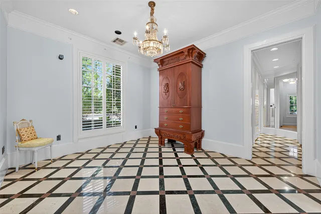 a living room with a black white checkered floor with a dining table and chairs