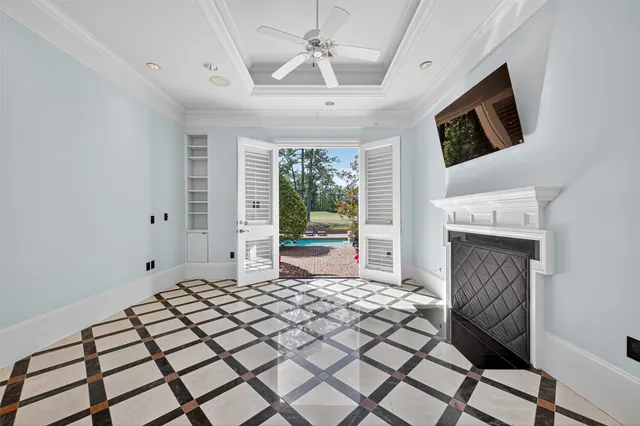a bathroom with a sink mirror and a shower