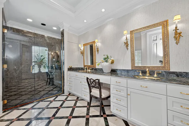 a spacious bathroom with a granite countertop sink and a mirror