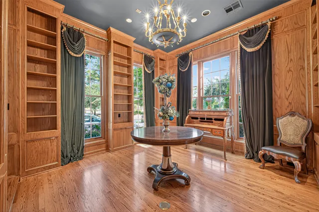 a view of a room with furniture and wooden floor