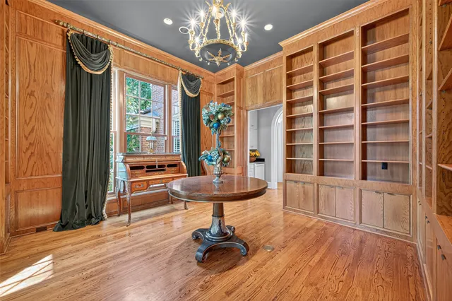 a view of a room with furniture and wooden floor