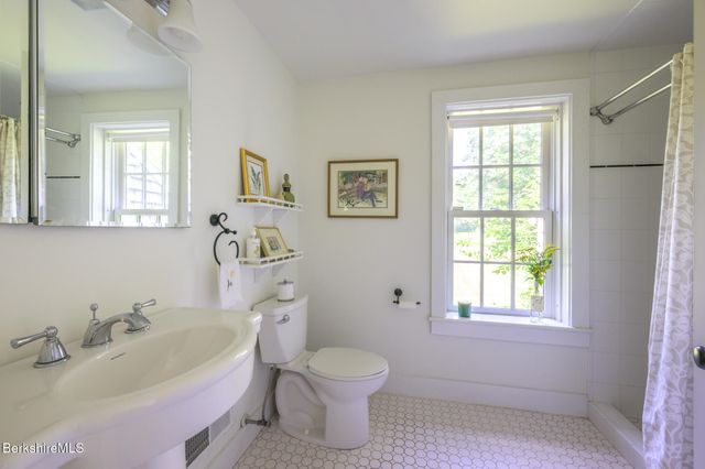 a bathroom with a sink toilet and a bathtub